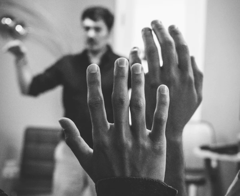 hand raised black and white